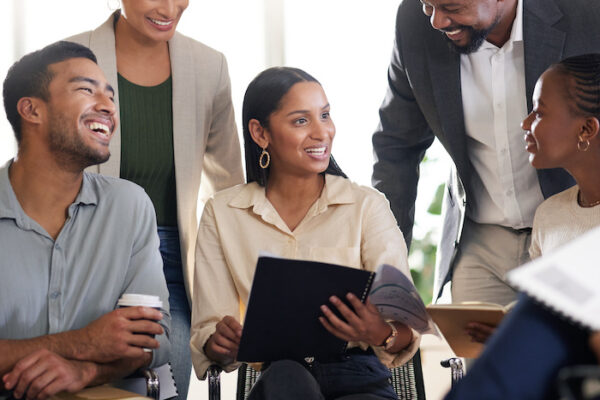 Cropped shot of a diverse group of businesspeople sitting in the boardroom during a meeting.