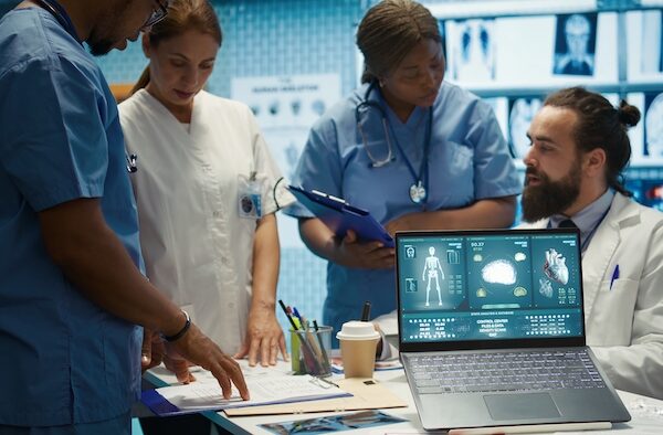 Professional medical team examine hospital records and treatment outcomes in a clinic to ensure quality insurance services. Physician specialist analyzing test results for expert solutions. Camera B.